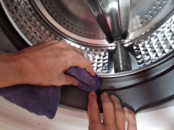 Concept of cleaning detail of washing machine stainless drum inside Concept of cleaning detail of washing machine, stainless drum inside, closeup washing machine drum stock pictures, royalty-free photos & images