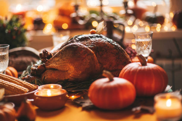 istock Thanksgiving holiday dinner table setting with fall decoration and pumpkins 1791523037