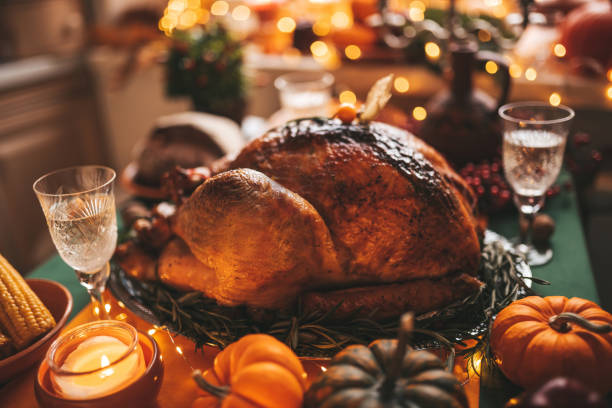 istock Thanksgiving holiday dinner table setting with fall decoration and pumpkins 1791523039