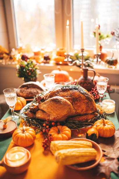 istock Thanksgiving holiday dinner table setting with fall decoration and pumpkins 1791523053