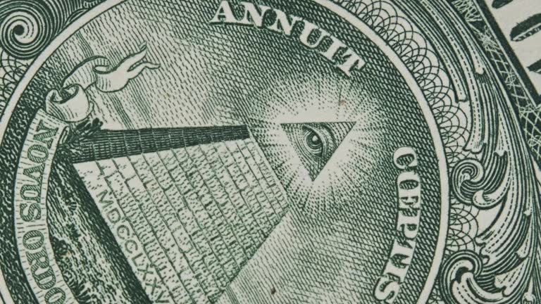 Mason Sign Symbol of the All Seeing Eye Rotates on a One Dollar Bill Close-Up