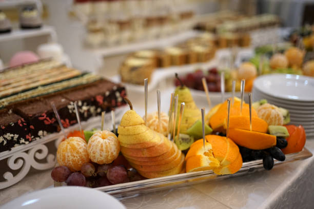 istock The buffet table is decorated with pears, oranges, grapes, kiwi. 1791545579