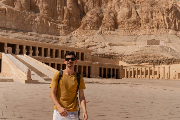 istock young man visits Hatshepsut temple in Luxor. Egypt 1791549478