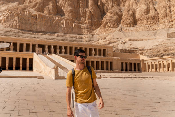 istock young man visits Hatshepsut temple in Luxor. Egypt 1791549482