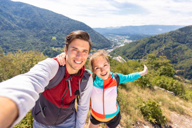 istock Couple taking a selfie video, mountain panorama in the background 1791556788
