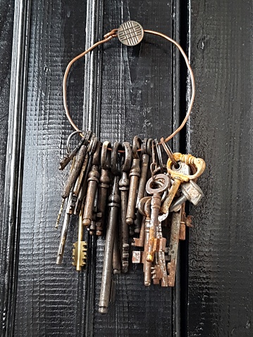 Antique keys for a door with an internal lock are on the sheet.
