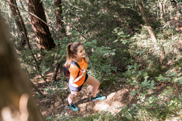 istock Female walking a hiking path over the forest 1791562275