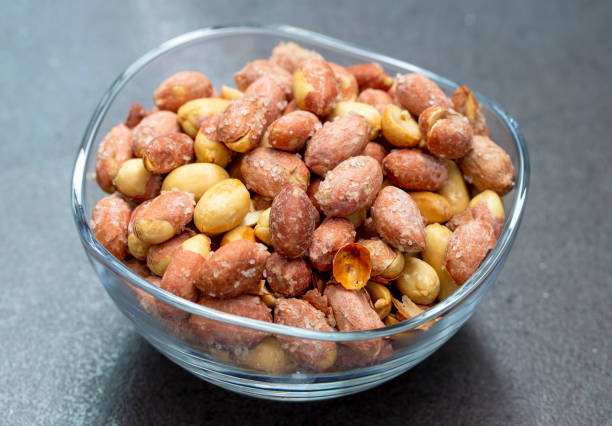 istock Salted peanuts in a glass bowl 1791563414