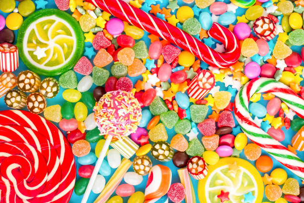 istock Colorful lollipops and different colored round candy. Top view. 1791566100