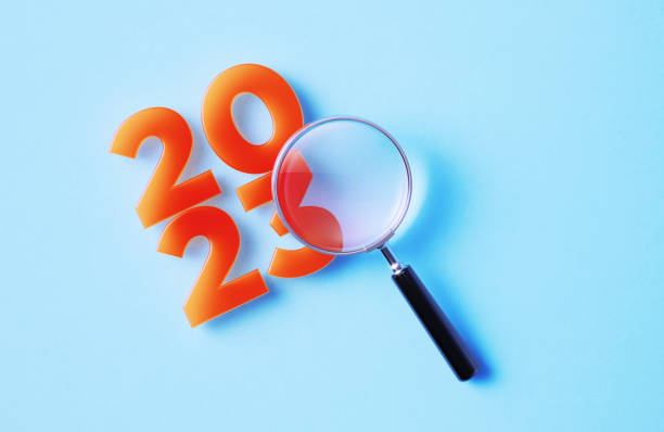 Magnifier And 2023 On Blue Background