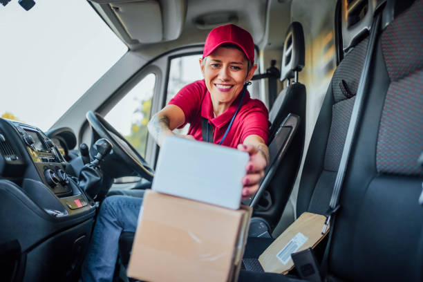 istock Female courier at delivery van 1791595225