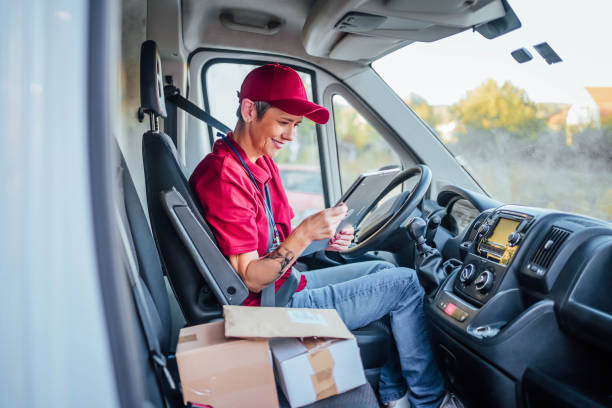 istock Delivery woman checking orders on digital tablet 1791599723