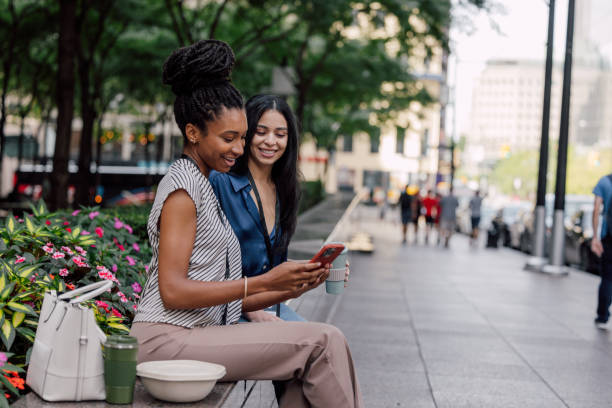 istock Office workers sitting outdoors to enjoy their lunch break 1791605285