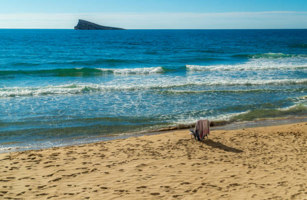 istock Two empty chairs in the sand beach, in Benidorm 1791607615