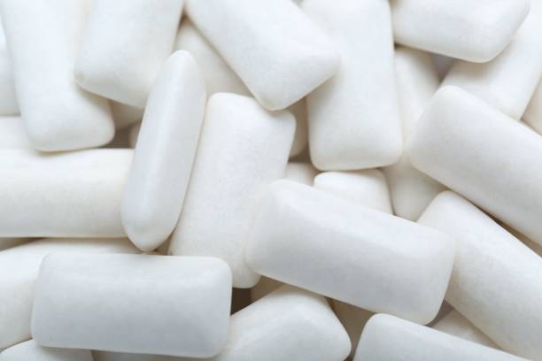 istock Tasty white chewing gums as background, top view 1791609121