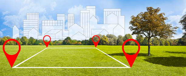 istock Land plot management - real estate concept with a vacant land available for building construction in a new residential area outside urban downtown in a suburbs of a modern city with cityscape on background 1791609219