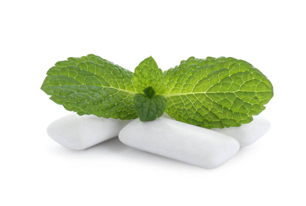 istock Three chewing gum pieces and mint on white background 1791609638