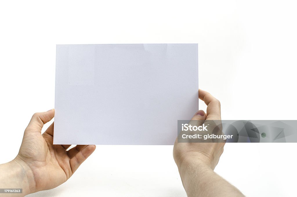 Holding a white flyer A young woman is holding a blank white flyer Blank Stock Photo