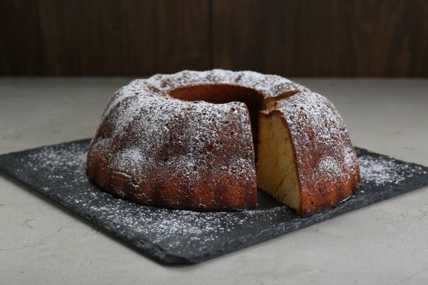istock Homemade yogurt cake with powdered sugar on light grey table 1791618455