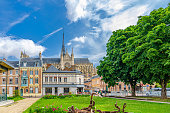Amiens cityscape of old historical city centre with traditional houses, Cathedral Basilica of Our Lady Notre-Dame, Square Jules Bocquet, blue sky background, Hauts-de-France Region, Northern France