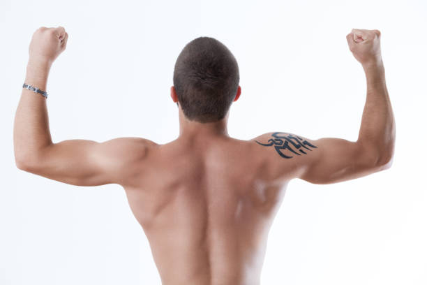 istock Victory pose, muscular back, tribal tattoo 1791639973
