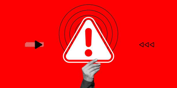 istock Attention concept. Hand holds danger warning sign with exclamation mark on red background. Minimalist art collage 1791652474