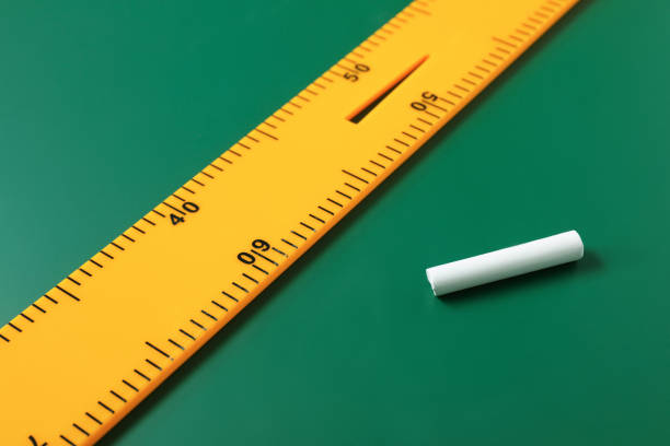 istock Ruler and chalk on green chalkboard, closeup 1791671236