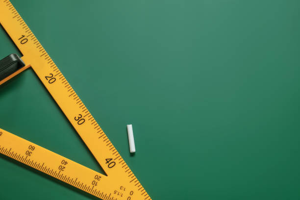 istock Yellow triangle and chalk on green chalkboard, flat lay. Space for text 1791671239