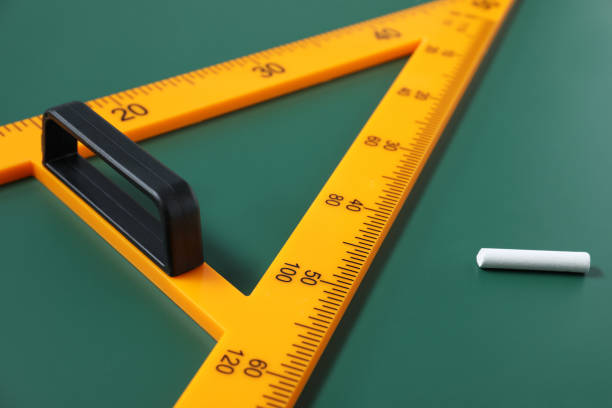 istock Triangle and chalk on green chalkboard, closeup 1791671250