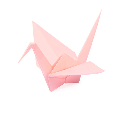 Origami art. Beautiful pale pink paper crane isolated on white