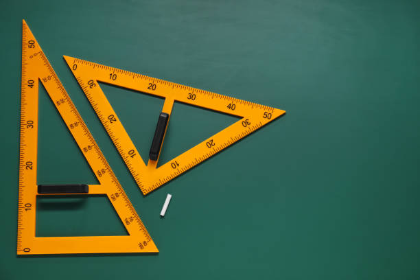 istock Triangles and chalk on green chalkboard, flat lay. Space for text 1791672868