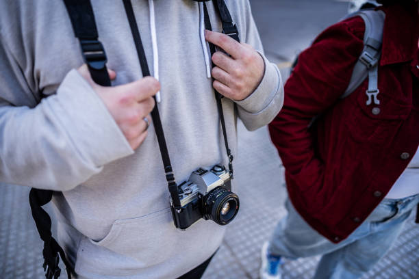 Photographic camera on traveler's neck