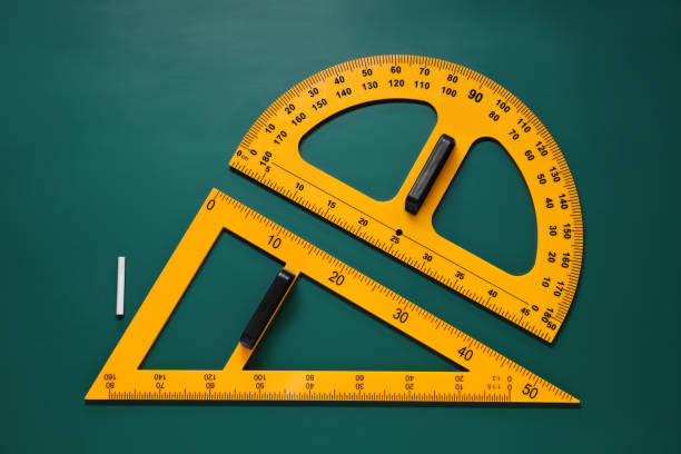 istock Protractor, triangle and chalk on green chalkboard, flat lay 1791673434