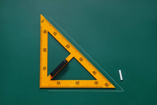 istock Yellow triangle and chalk on green chalkboard, flat lay 1791673440