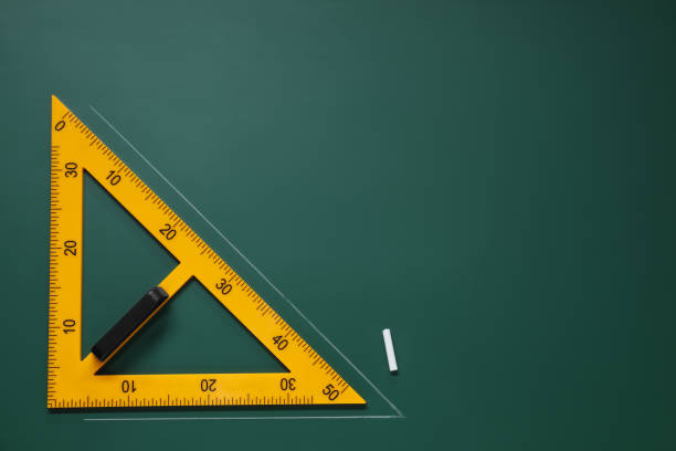 istock Yellow triangle and chalk on green chalkboard, flat lay. Space for text 1791673462