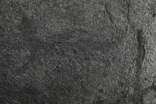 istock Texture of dark grey stone surface as background, closeup 1791691091