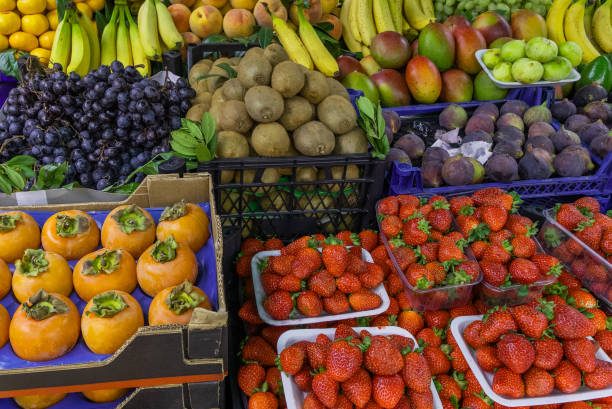 istock Fruit stand, kiwi, pomegranate, grapes, bananas, strawberries, persimmons. 1791691643