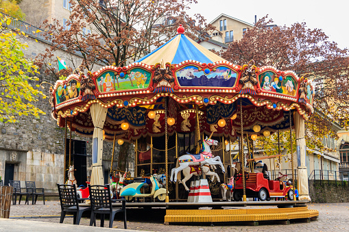 Vintage carousel (merry-go-round) in amusement park