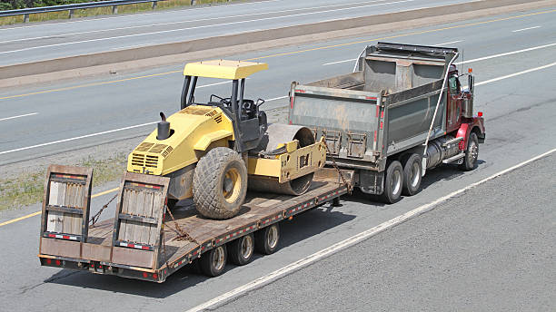 truck towing dump roller truck