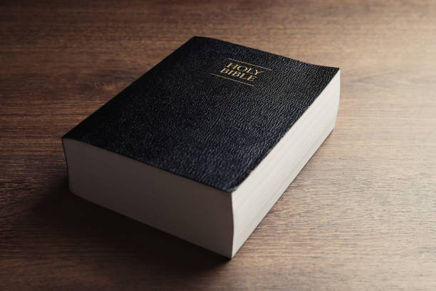 istock Holy Bible on wooden table, closeup. Religious book 1791693851