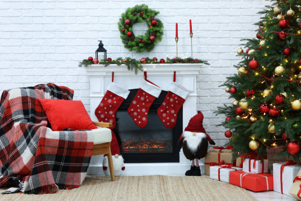 istock Cosy room with tree and fireplace decorated for Christmas. Interior design 1791695498