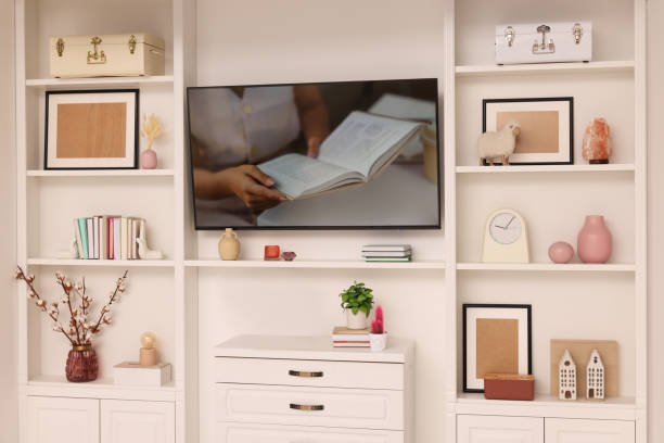 istock TV and shelves with different decor in room. Interior design 1791695504