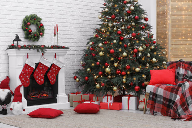 istock Cosy room with tree and fireplace decorated for Christmas. Interior design 1791696107