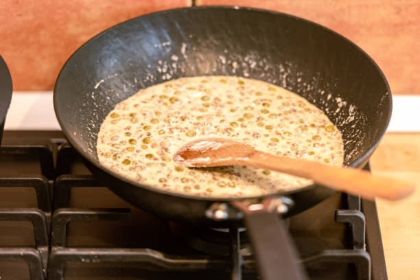 istock Preparing Delicious Cream Sauce with Green Peas 1791701630