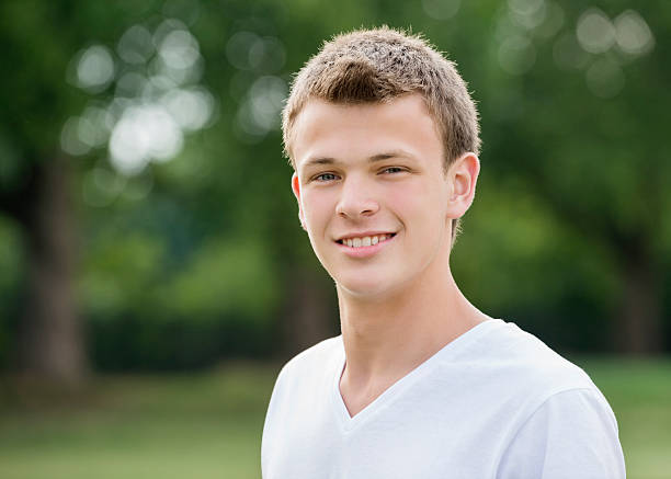 istock Teenage Boy Smiling In Park 179172310