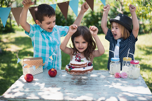 Little children celebrating birthday party.