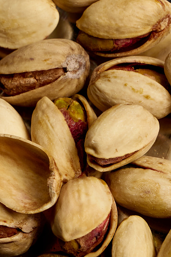 Close up photos of pistachios inside the shell