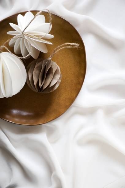 istock a plate with three small white flowers on it's side 1791746588