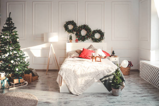 istock Bed with New Year's decorations. New Year's interior. Christmas tree 1791756402