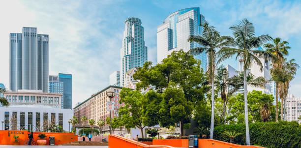 historic millennium biltmore hotel, u.s. bank tower, and the deloitte building or gas company tower, view from pershing square, downtown los angeles, ca - u s bank tower imagens e fotografias de stock